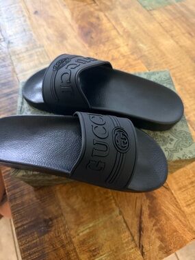 Gucci Men's Matte Black Embossed Logo Slide Sandals